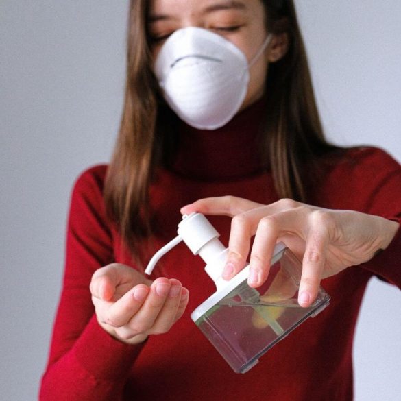 Woman Using Hand Sanitizer