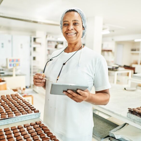 Woman in bakery smiling