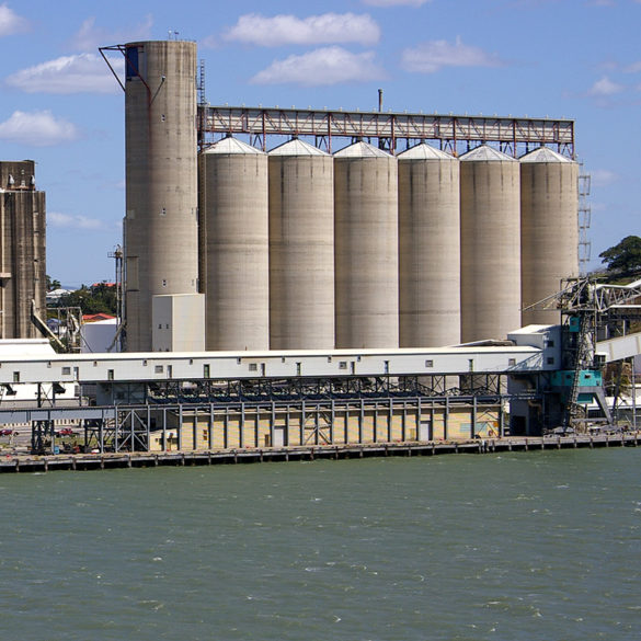 large grain silo along a waterfront